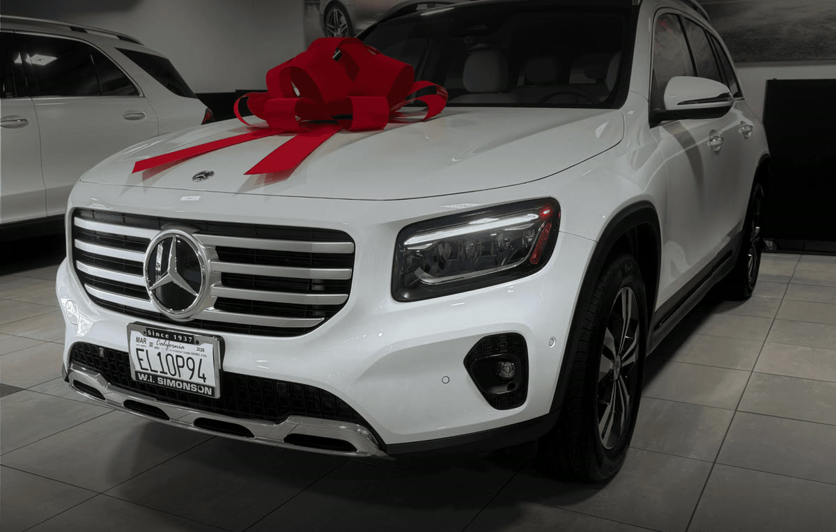White Mercedes-Benz GLB with a red bow